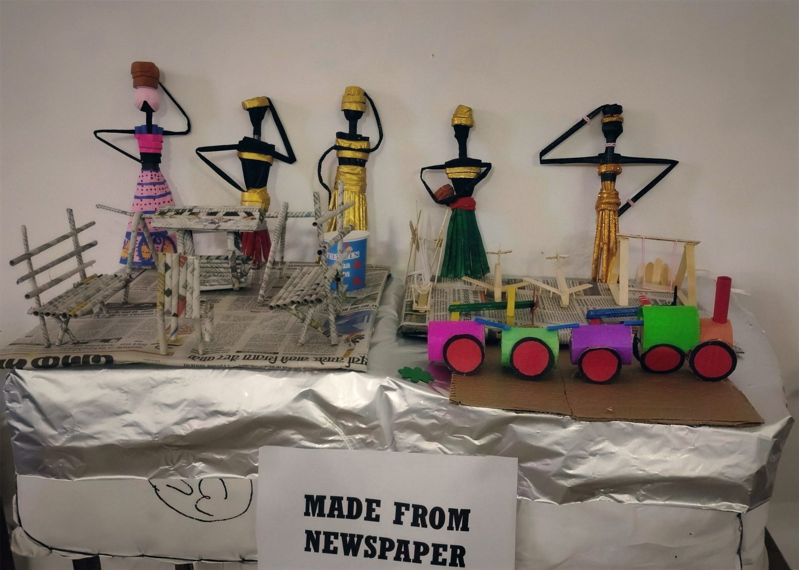 Handmade craft models on display at a school exhibition